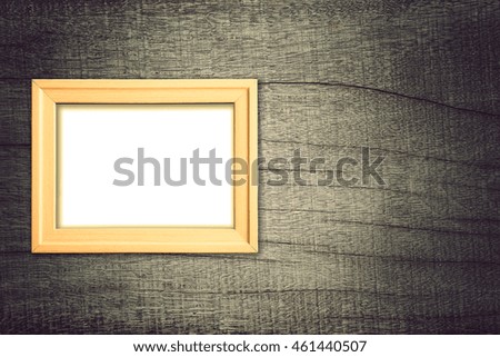 Photo frame on old wooden background
