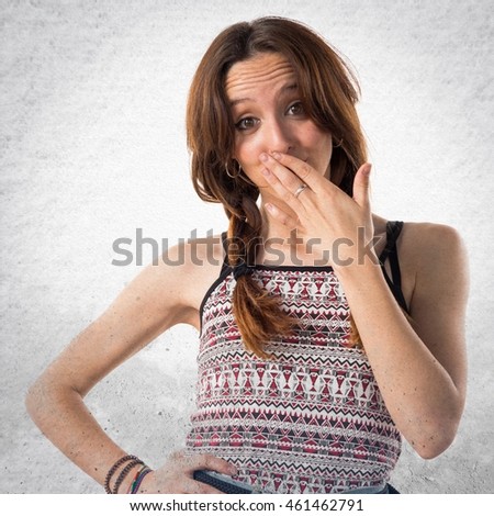 Girl doing surprise gesture over textured background