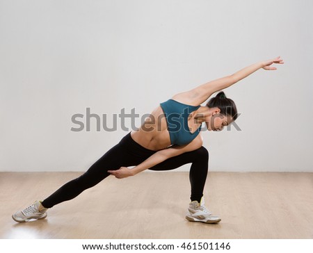 Picture of professional fitness yoga with muscles training over white background. Beautiful woman practicing yoga asana in studio.