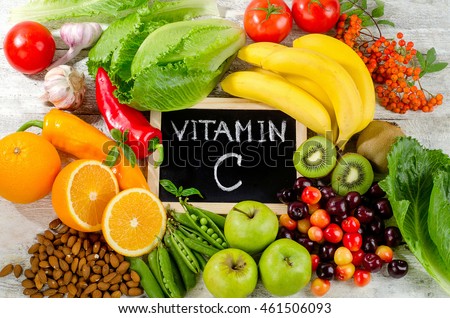 Foods High in vitamin C on a wooden board.  Healthy eating. Top view Royalty-Free Stock Photo #461506093