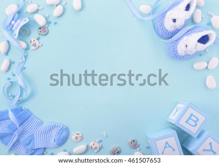 Its a boy, blue theme Baby Shower or Nursery background with decorated borders on pale blue wood background. Royalty-Free Stock Photo #461507653