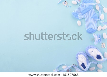 Its a boy, blue theme Baby Shower or Nursery background with decorated borders on pale blue wood background. Royalty-Free Stock Photo #461507668