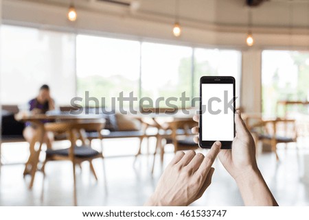hand using smartphone with white screen on blur blackground