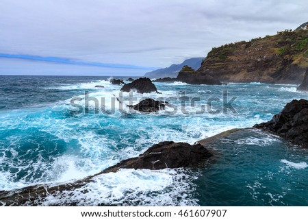 Seixal ocean natural pools and bay at Madeira northern coastline. Portugal.