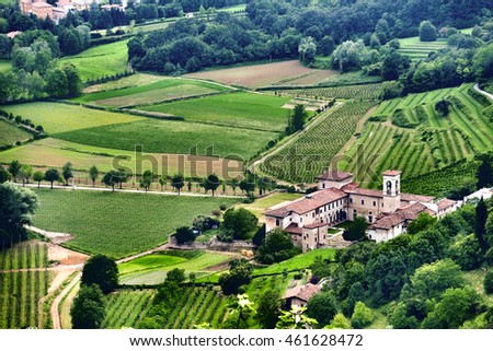 Traditional winery with vineyards in front in Italy near Milano Bergamo - Lombardia region Royalty-Free Stock Photo #461628472