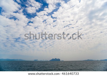 view at perfect tropical island, surrounding turquoise lagoon and blue sky
