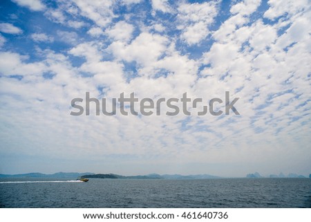 view at perfect tropical island, surrounding turquoise lagoon and blue sky