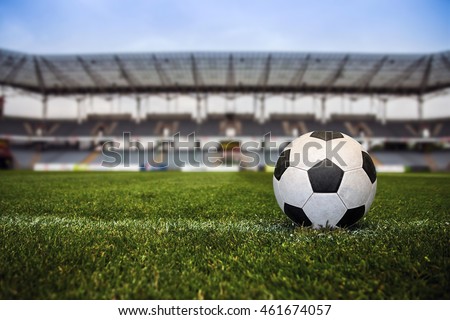 Soccer ball with stadium on the background. Royalty-Free Stock Photo #461674057