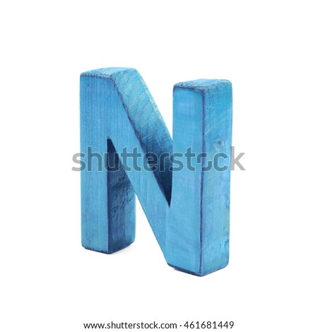 Single sawn wooden letter N symbol coated with paint isolated over the white background
