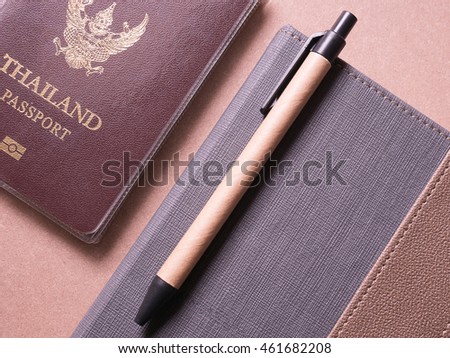 business set of thailand passport and notebook with sticky note in concept Travel notebook