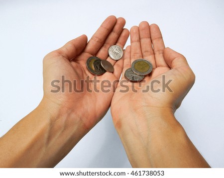 woman's hand hold coin on white background