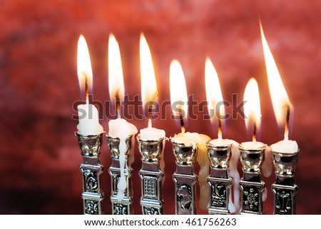 Image of jewish holiday Hanukkah background with menorah traditional candelabra Burning candles