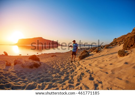 panoramic view on Balos beach, Crete, Greece. Man, traveller and photographer runss on the beach