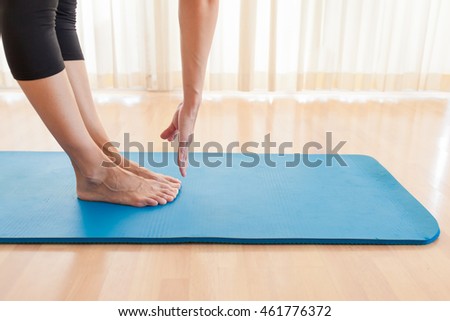Woman doing stretching exercise. 
