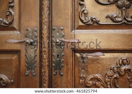 Rustic wooden door with iron handles