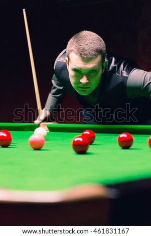 Detail from game of snooker. Player evaluating the situation