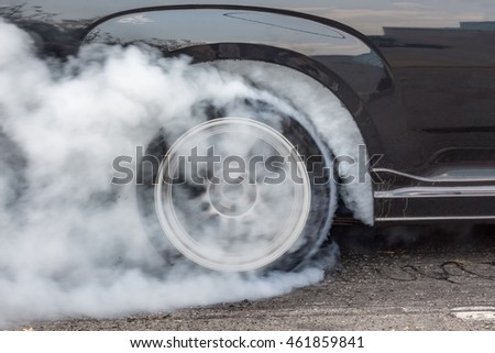 Dragster Car Burn Out Rear Tyre With Smoke Royalty-Free Stock Photo #461859841