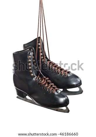 A pair of black figure skates hanging by laces, isolated on white