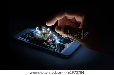 Currencies sign icon and smartphone with stock market graph screen and finger with black background. Blockchain , Fintech Investment Financial Internet Technology Concept.