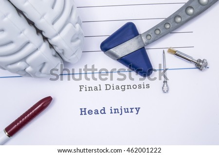 Printed medical form with neurological diagnosis Head injury with the figure of the human brain, neurological reflex hammer, neurological needle and brush for test sensitivity and ballpoint pen