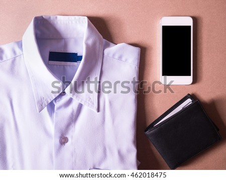business clothes set of white smart phone and black wallet in concept new employees