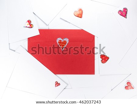 Red envelope between white ones.
