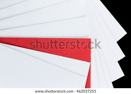 Red envelope between white ones.