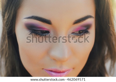 Woman of the Korean race, close. Pink shadows, beautiful eyes. Make-up