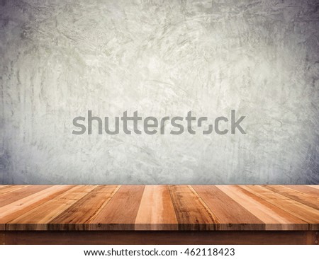 Empty brown wood plank table top with grunge concrete wall,Mock up for display or montage of product,use as background
