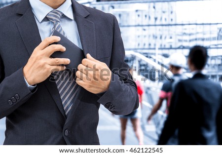 isolated business man hold the smartphone on bridge background
