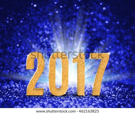 2017 new year with gold glitter texture with white explore light on blue sparkling background,Holiday Concept