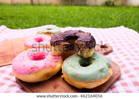 Donuts on tray wood.