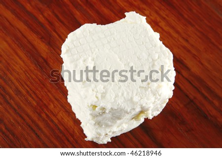 whole white light feta cheese on dishware