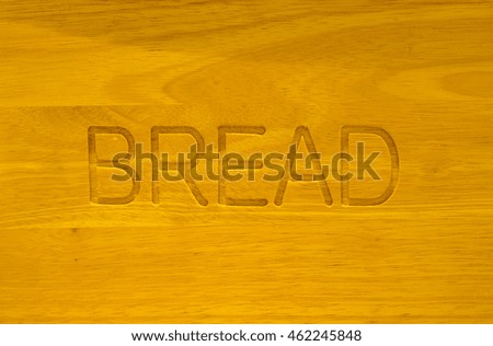 Bread word engrave in wooden board