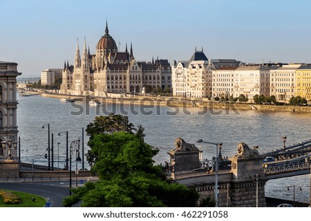 Parliament in Budapest view, Szechenyi Lanchid bridge with lions.  Royalty-Free Stock Photo #462291058