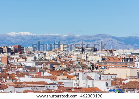 panoramic aerial view of the city of madrid with the skyline of the sierra mountains