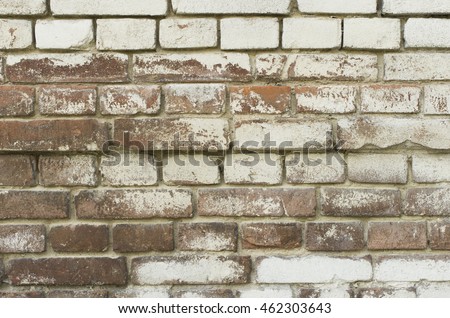 Old brickwork painted white paint. Background - Stock image