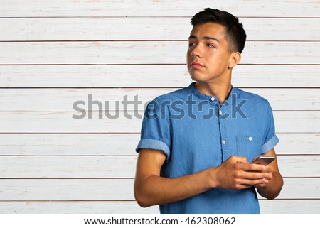 young man looking on his smartphone