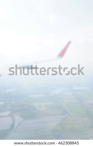 Blurred abstract background of Wing aircraft in the sky