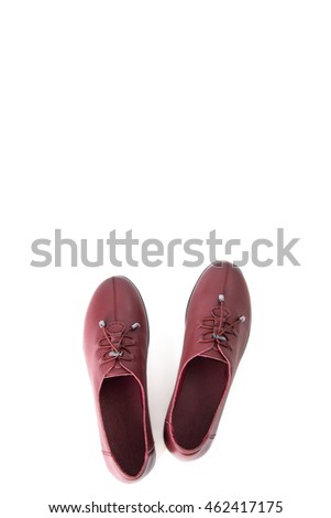 Beautiful vintage Pair of fashion woman leather shoes with front view profile and copy space, isolated on white background.
