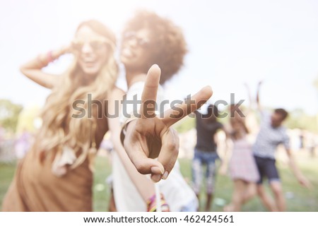 Peace sign made by african descent woman
