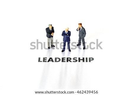 Leadership with miniature businessman 