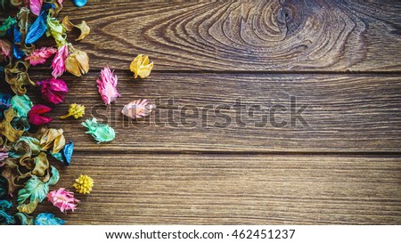 aromatherapy potpourri mix of dried aromatic flowers on wooden background with copy space