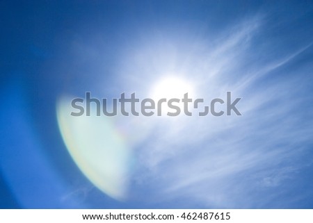 Sun sky flare light blue background.