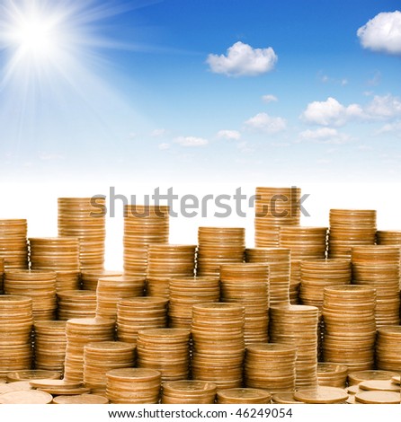 Golden coins against the blue sky