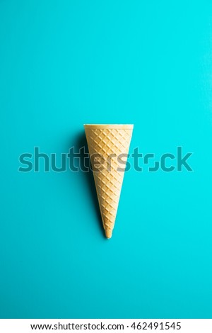 Sweet wafer cone on color background. Top view.