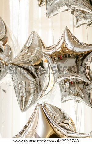 Restaurant hall reflecrs in the silver balloons