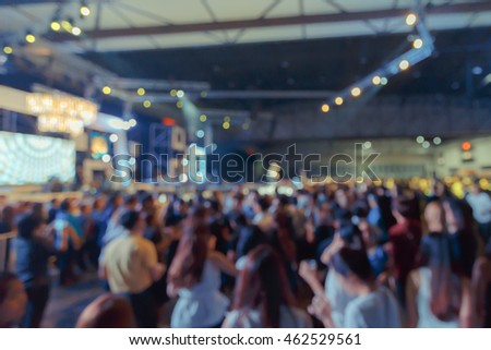 Crowd  in front of concert stage blurred