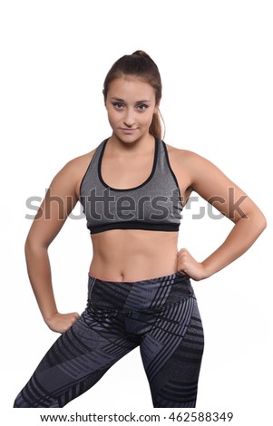 Portrait of beautiful and athlete young woman. Isolated white background.