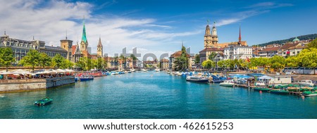 Panoramic view of historic Zurich city center with famous Fraumunster, Grossmunster and St. Peter and river Limmat at Lake Zurich on a sunny day with clouds in summer, Canton of Zurich, Switzerland Royalty-Free Stock Photo #462615253